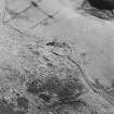 Oblique aerial view of Bairn's Hill centred on the remains of a farmhouse, farmsteading and township, taken from the NW.