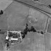 Oblique aerial view of Castle of Wardhouse centred on the cropmarks of medieval earthworks, enclosure, chapel and possible motte, taken from the NNE.