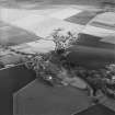 Oblique aerial view centred on the village, taken from the WNW.