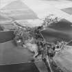 Oblique aerial view centred on the village, taken from the W.