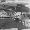 Oblique aerial view centred on the village, taken from the SSE.