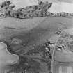 Oblique aerial view of Wardhouse Home Farm centred on the remains of hut-circles, small cairns and rig with rig, small cairns, farmstead, quarry and cottage adjacent, taken from the S.