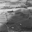 Oblique aerial view of Rosa Croft centred on the remains of cairns and field-system with small cairns and quarry adjacent, taken from the N.