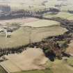 Oblique aerial view of Wardhouse Home Farm centred on the remains of hut-circles, small cairns and rig with rig, small cairns, quarry and cottages adjacent, taken from the NE.