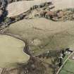 Oblique aerial view of Wardhouse Home Farm centred on the remains of rig, small cairns and farmstead with hut-circles, small cairns and cottage adjacent, taken from the S.