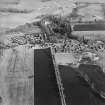 Oblique aerial view centred on the village, taken from the W.