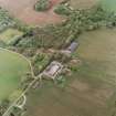 Oblique aerial view centred on the Home Farm, taken from the NE.
