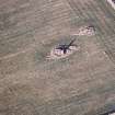 Oblique aerial view centred on the remains of the recumbent stone circle, taken from the S.