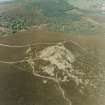 Oblique aerial view centred on the remains of the fort, taken from the SW.