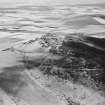 Oblique aerial view centred on the remains of quarries taken from the WNW.