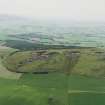 Oblique aerial view centred on the remains of the quarries, taken from the NNE.