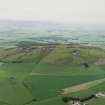 Oblique aerial view centred on the remains of the quarries, taken from the N.