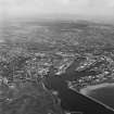 Oblique aerial view centred on the harbour, taken from the E.

