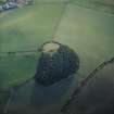 Oblique aerial view centred on the remains of the recumbent stone circle, taken from the NNE.