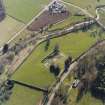 Oblique aerial view centred on the remains of the abbey and the house, farmhouse and farmsteading, taken from the NE.