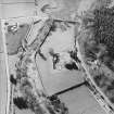 Oblique aerial view centred on the remains of the abbey and the house, farmhouse and farmsteading, taken from the ESE.