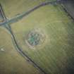 Oblique aerial view centred on the remains of the recumbent stone circle, taken from the WNW.