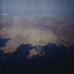 General oblique aerial view centred on the crofting townships of Skallary and Earsary, looking across Sheabhal towards Borgh, taken from the SE.