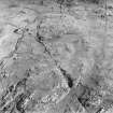 Oblique aerial view of Totamore centred on the remains of a field-system and rig with a general view of Clabhach and the remains of a farmstead visible, taken from the NW.