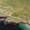 Oblique aerial view of Feall Bay centred on the remains of a fort, cairn, clearance cairns and rig, taken from the WSW.