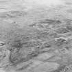 Oblique aerial view of Allt a' Mhuilinn centred on the remains of buildings and rig, taken from the SSE.