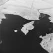 Oblique aerial view of Loch Cliad centred on a two crannogs, taken from the SE.