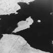 Oblique aerial view of Loch Cliad centred on a two crannogs, taken from the NW.