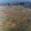 Oblique aerial view of the crofting township and field-system with farmstead adjacent taken from the  WSW.