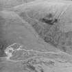 Oblique aerial view centred on the mine and buildings, taken from the S.