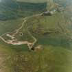 Oblique aerial view centred on the mine and buildings with farmstead adjacent, taken from the WSW.