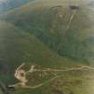 Oblique aerial view centred on the mine and buildings, taken from the S.