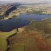 General oblique aerial view of the Lake of Menteith centred on the priory and crannog, taken from the SW.