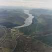 General oblique aerial view looking over the village of Dalwhinnie along Loch Ericht, taken from the NNE.