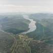 General oblique aerial view looking over the village of Dalwhinnie along Loch Ericht, taken from the NNE.