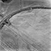 Comrie Castle, oblique aerial view, taken from the E, centred on cropmarks including those of a possible enclosure.