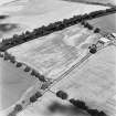 Strageath Mains, oblique aerial view, taken form the SSW, centred on cropmarks of field boundaries and pits.