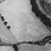 Lagg, oblique aerial view, taken from the SSW, centred on a complex of cropmarks which include a barrow, square barrow and pits.