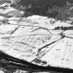 General oblique aerial view of the tower-house and country house, taken from the SE.