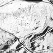 Oblique aerial view centred on the remains of the small cairns, taken from the NW.