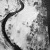 Bulroy, oblique aerial view, taken from the S, centred on a farmstead and rig. Remains of a township are visible in the top left-hand corner of the photograph.