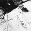 Oblique aerial view of the farmstead, farmsteading, and the the remains of the homestead, taken from the NW.