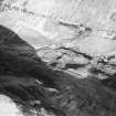 Oblique aerial view centred on the remains of a sheepfold, field banks and rig, taken from the SW.