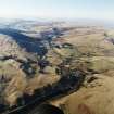 General oblique aerial view looking across the village, taken from the ESE.