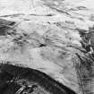 Oblique aerial view centred on the remains of the field-system, rig and trackway, taken from the SE.