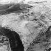 Oblique aerial view centred on the remains of the field-system, rig and trackway, taken from the ESE.