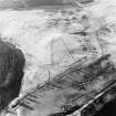 Oblique aerial view centred on the remains of the field-system, rig and trackway, taken from the ESE.