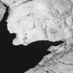 Oblique aerial view centred on the remains of farmstead, head-dyke, enclosures, rig and sheepfold, taken from the ENE.