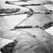 Raith, oblique aerial view taken from the NE, centred on a circular cropmark of a possible sunken floored building.