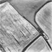 East Mill Farm, oblique aerial view taken from the N, centred on the cropmarks of a ring ditches and pits.