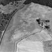 Fendoch, oblique aerial view, taken from the WSW, centred on cropmarks including those of a possible enclosure and a linear cropmark.